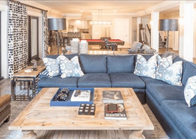 living room remodel with blue sectional and square coffee table