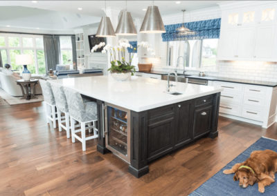 colonial kitchen with brown dog laying on rug next to island