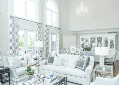 bright white living and dining room with large windows
