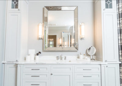 white bathroom vanity with tower storage