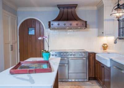 AGA mercury stove and range hood in tudor kitchen remodel