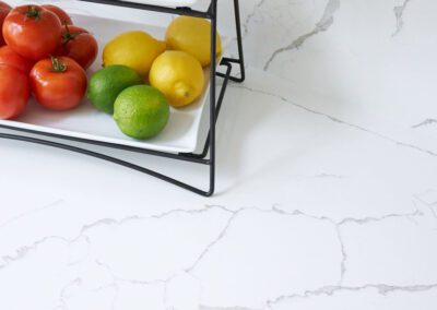 Matching White Countertop and Backsplash with Gray Veining in Renovated Ohio Kitchen