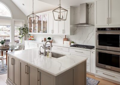 Large Kitchen Island with Pendant Lights and Lower Cabinets in Remodeled Ohio Home