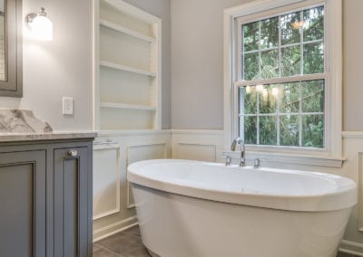 freestanding soaker tub by window