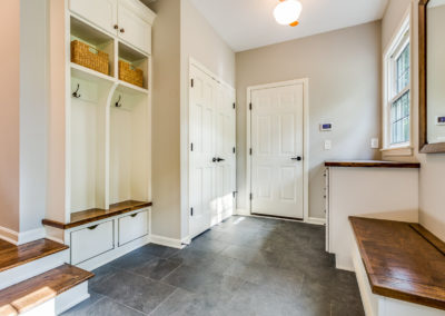 luxury mudroom renovation with built in bench and storage