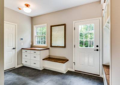 mudroom entry with built in bench and counter