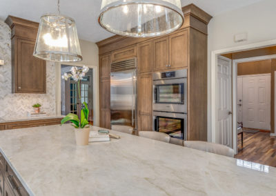 kitchen remodel with dark stained cabinets and pendant lighting