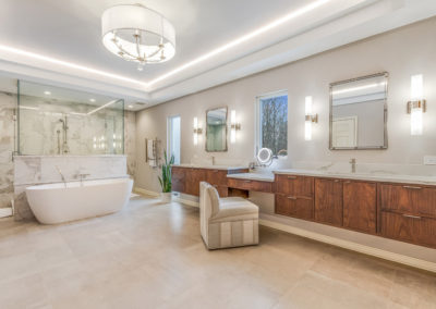 master bathroom with long wall mounted vanities