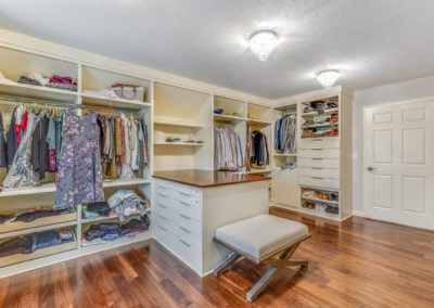 spacious master closet remodel with wood floors