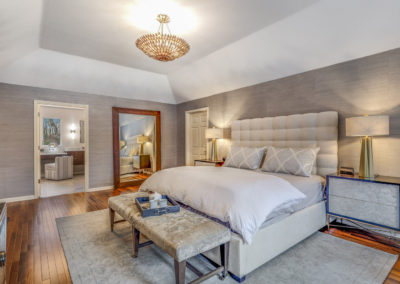 master bedroom remodel with tray ceiling and gray patterned wallpaper