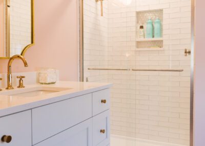 Tiled Shower with Niche and Gold Accents