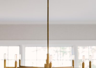 Gold Light Fixture in Dining Room