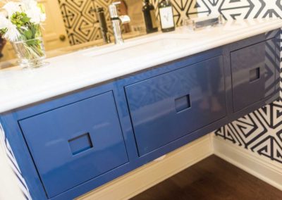 blue floating vanity with white countertop