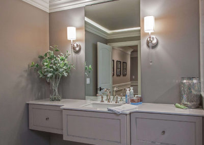 custom basement bathroom with single sink vanity