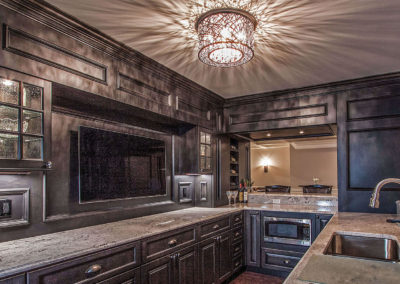 luxury kitchen renovation with dark wood cabinetry