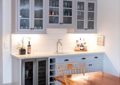 dining room buffet with bar sink and cabinets