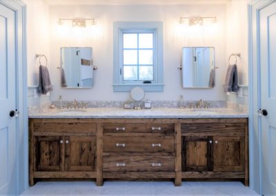 wood vanity with double sinks and mirrors