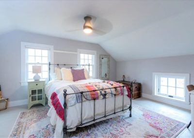 farmhouse bedroom with wrought iron frame bed