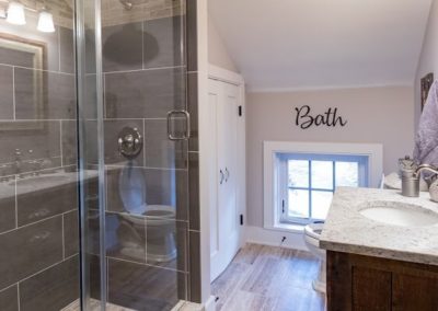 remodeled bathroom with gray tile shower
