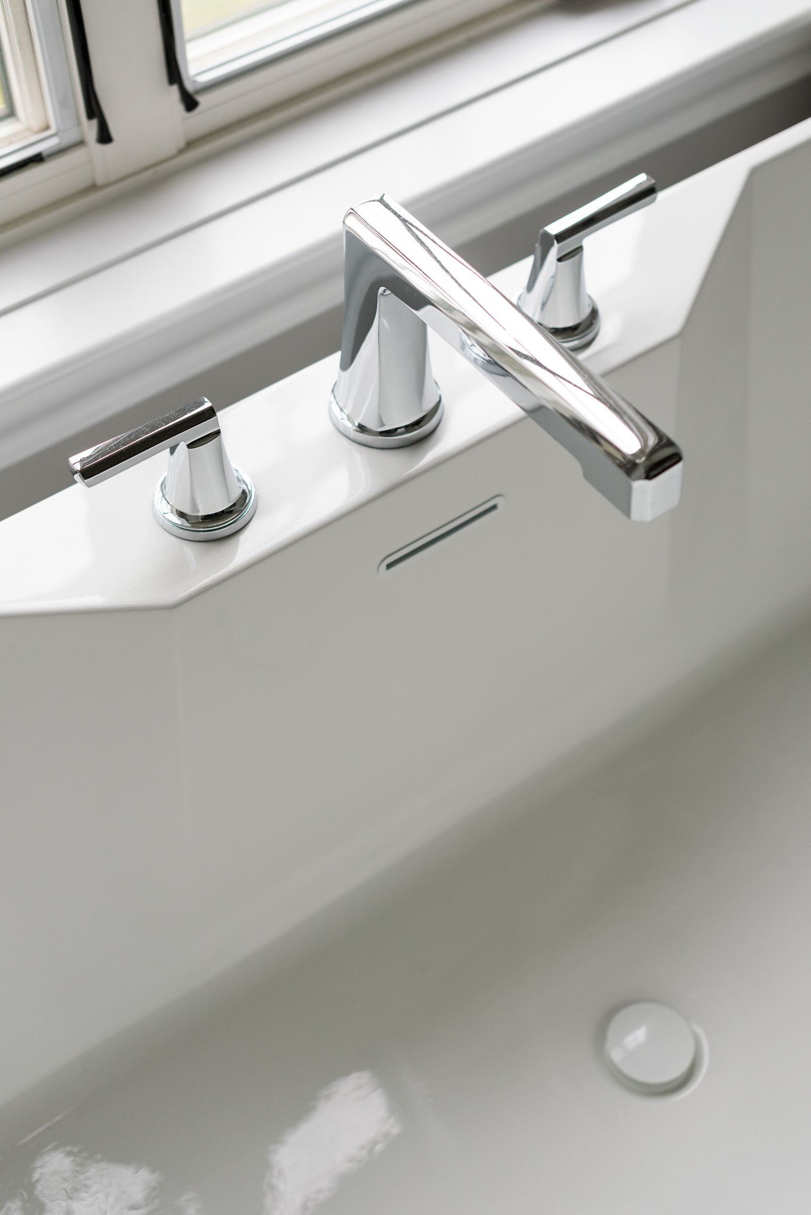 sleek silver tub faucet