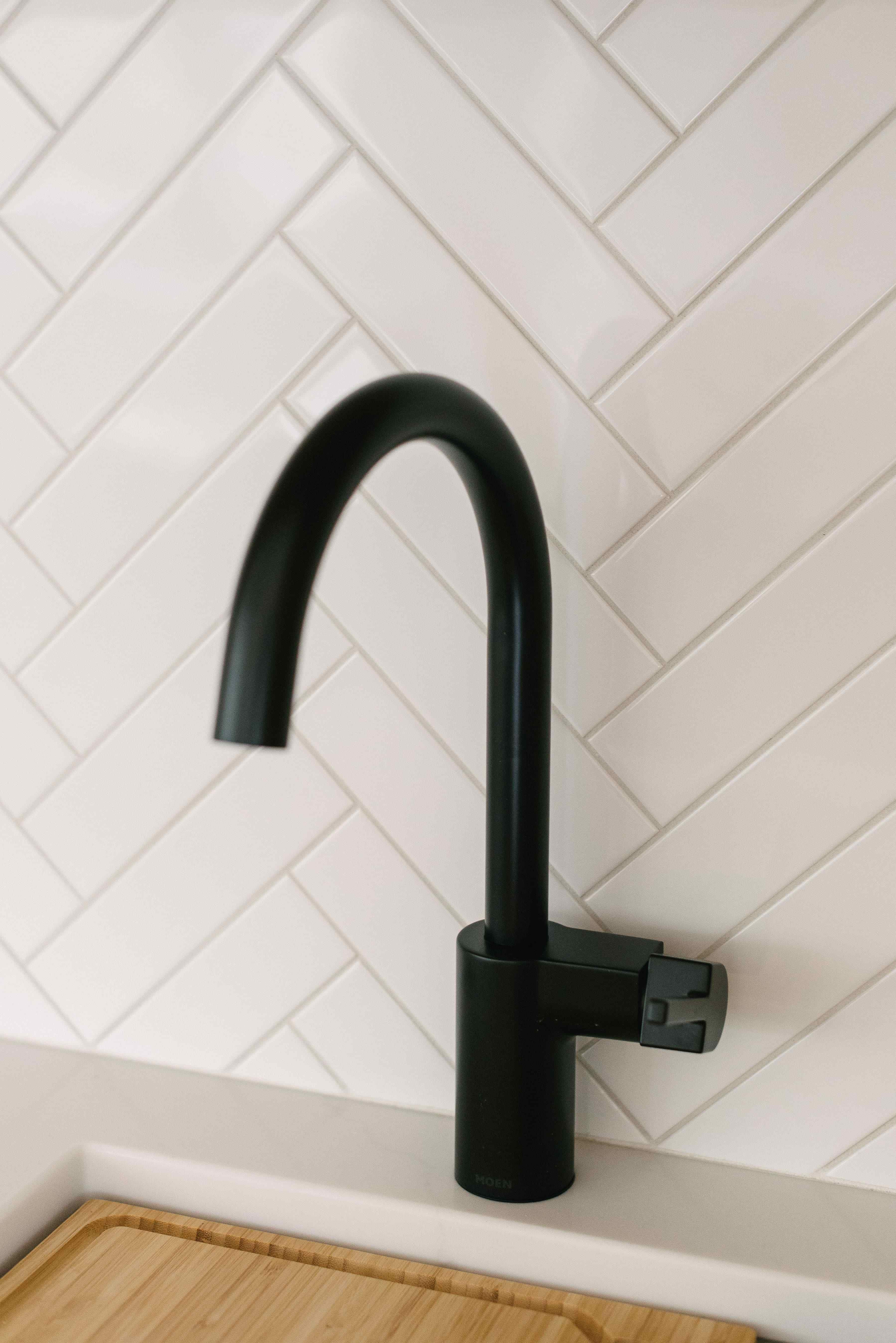 Black Wet Bar Faucet White Marble Backsplash