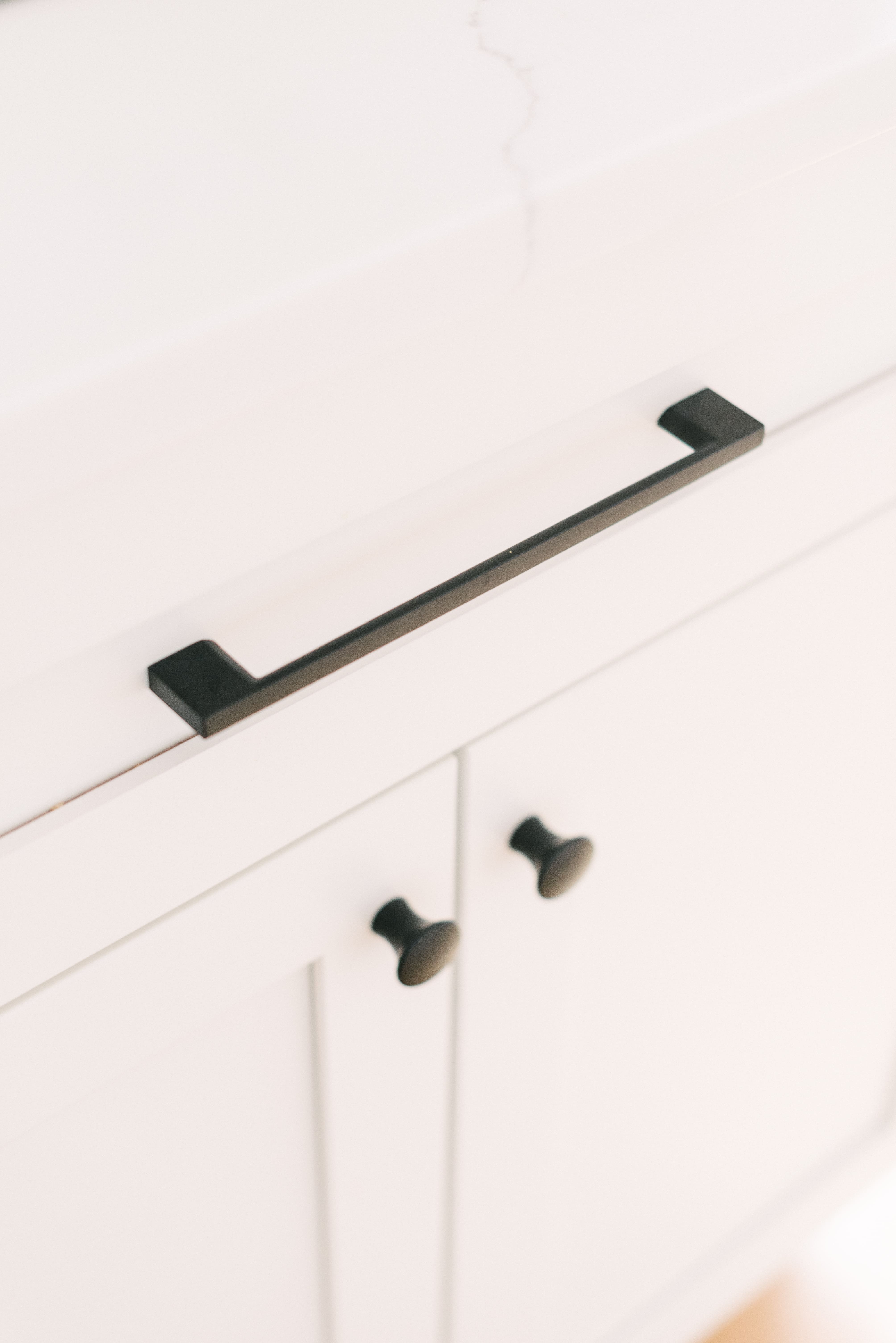 White Cabinets with Black Hardware and Pull