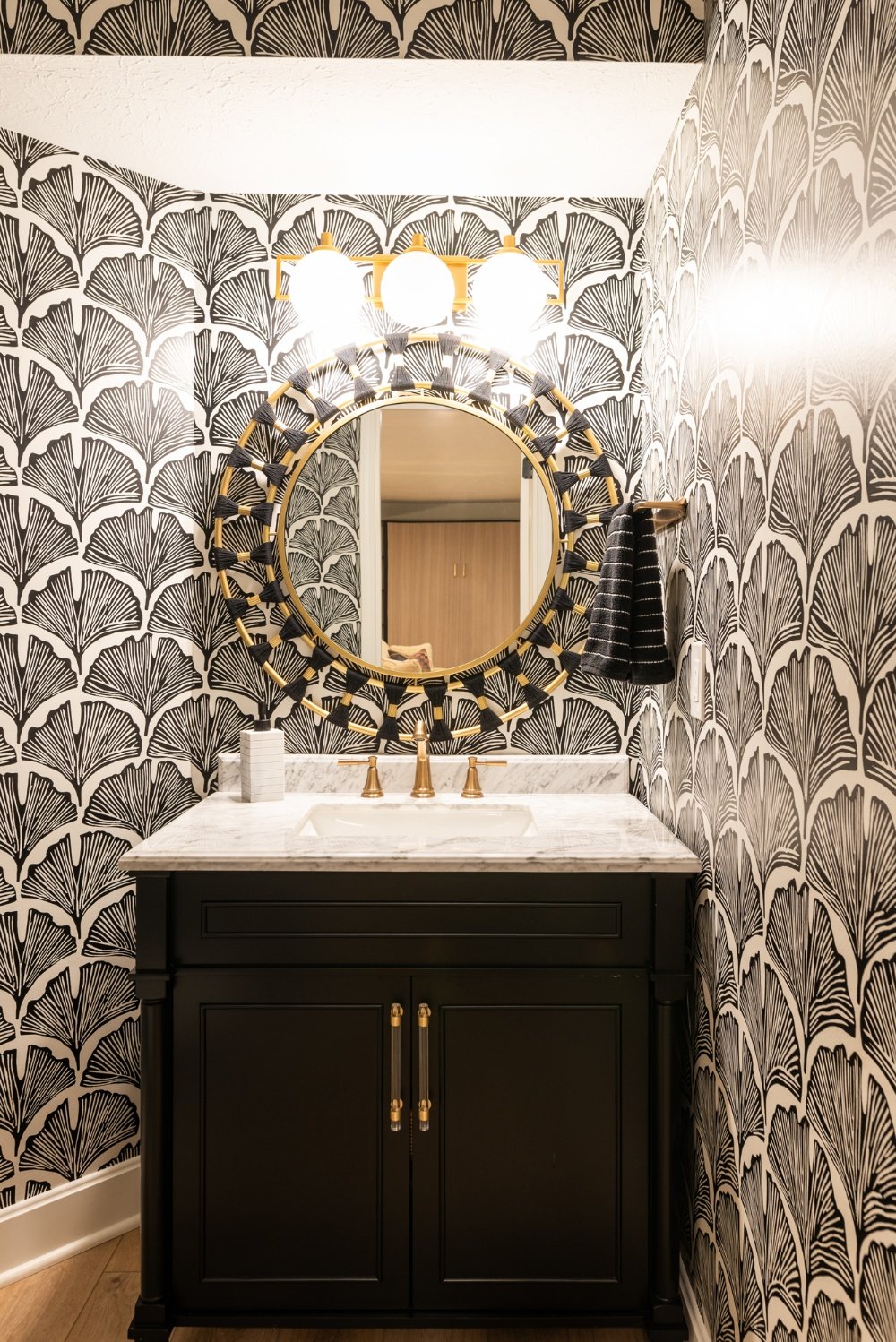 powder bathroom with pattern wallpaper