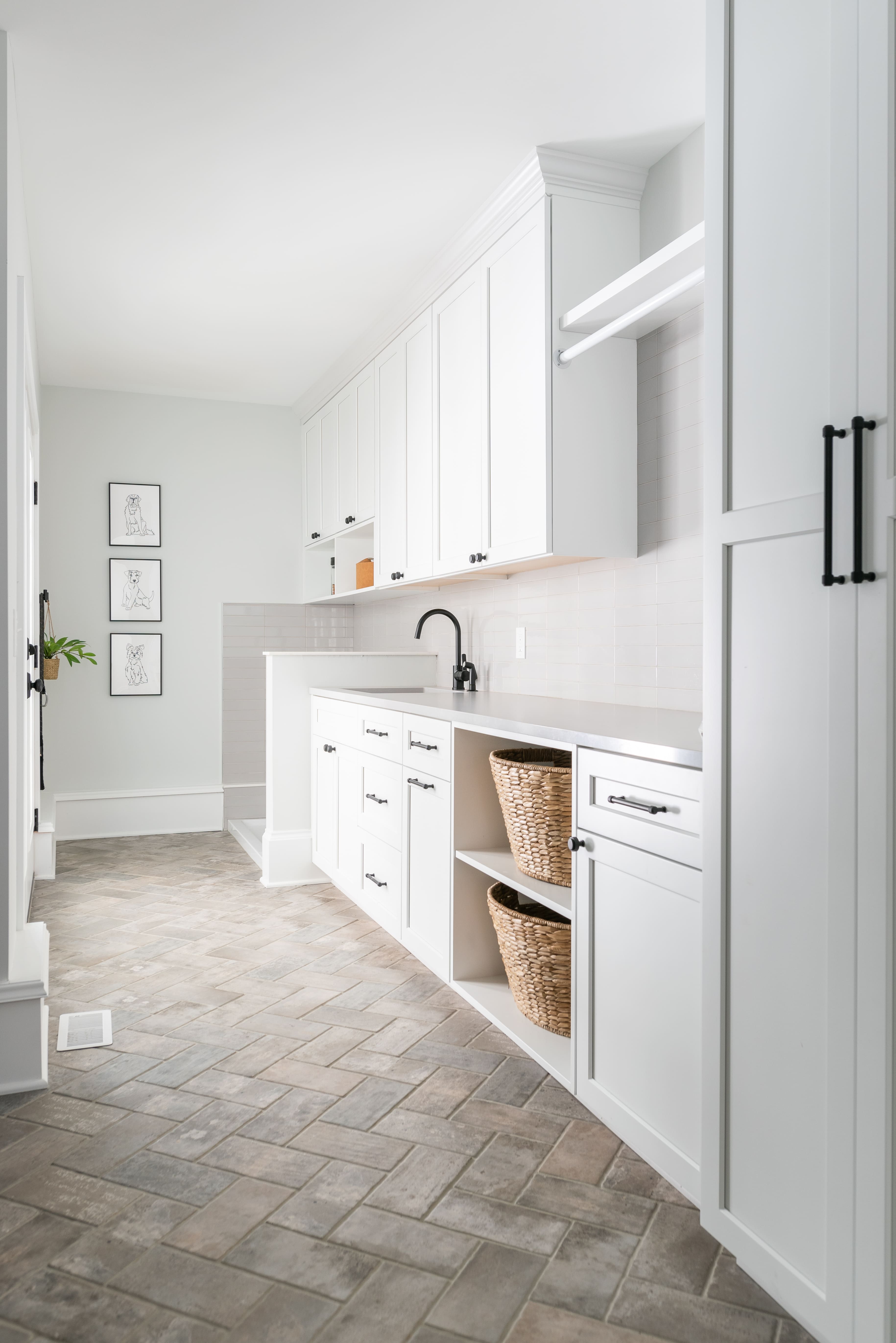 white mudroom storage Pepper Pike herringboen tile floor 